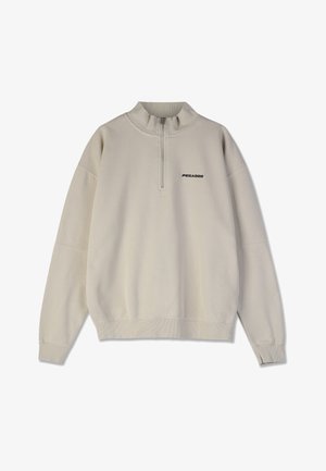 Beige pullover sweatshirt neljandikane lukuga kaelus, pikad varrukad, soonikkoesistused ning must broderitud "PEGADOR" logo rindkere piirkonnas.
