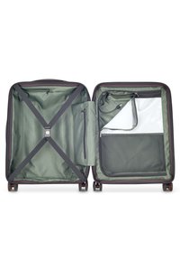 Valigia espandibile con esterno nero, interno verde, cinghie regolabili, molteplici tasche e ruote scorrevoli.