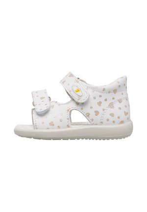 Sandalo bianco per bambino piccolo con pois glitter dorati, due cinturini regolabili in velcro e suola in gomma flessibile.