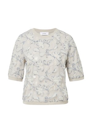 Wyszywana bluzka w kremowym kolorze z kwiatowym wzorem w jasnoniebieskim i białym, z krótkimi rękawami i okrągłym dekoltem ozdobionym lamówką.