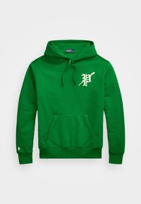 Grön huvtröja med kenguruficka, dragsko i huvan och ett broderat logotyp på bröstet. Mjukt bomullsblandat material, ribbstickade muddar.