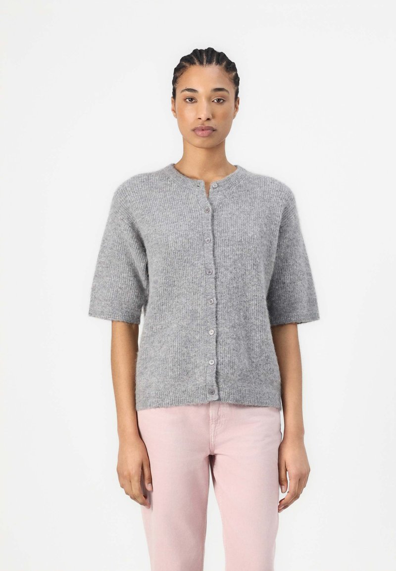 Gray knit cardigan with short sleeves, round neckline, and button closure. Soft texture with a subtle pattern, paired with light pink pants.