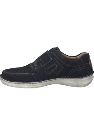 Sort ruskind slip-on sko med grå syninger, gummisål og en tekstureret bagside. Har en velcro-rem for en sikker pasform.