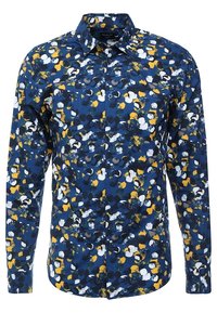 Långärmad skjorta med knappar i marinblått med ett flerfärgat abstrakt mönster som har vitt, gult och grönt. Bomullstyg, klassisk krage.