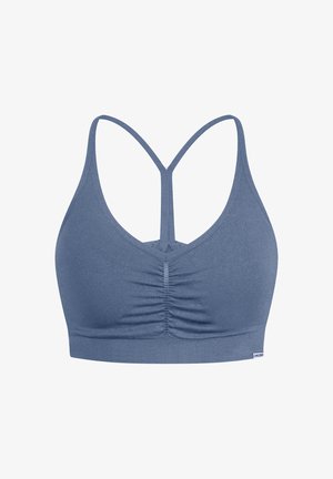 Blå strækbralette med en samlet front, tynde krydsetremmer og et bredt bånd i bunden. Glat tekstur, sporty design.