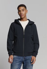 Navy hoodie met ritssluiting aan de voorkant, zijzakken en geribbelde manchetten. Gemaakt van gladde stof en beschikt over minimalistische designdetails.