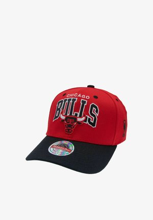 Red and black Chicago Bulls baseball cap with team logo and text embroidered on front, black brim, and a holographic sticker on the brim.