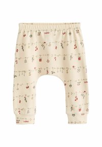 Kreminės medvilnės vaikiškos kelnės su šventiniu ornamentų, dovanų ir žvaigždžių printu, su elastinga juosta ir sutvirtintais manžetais.