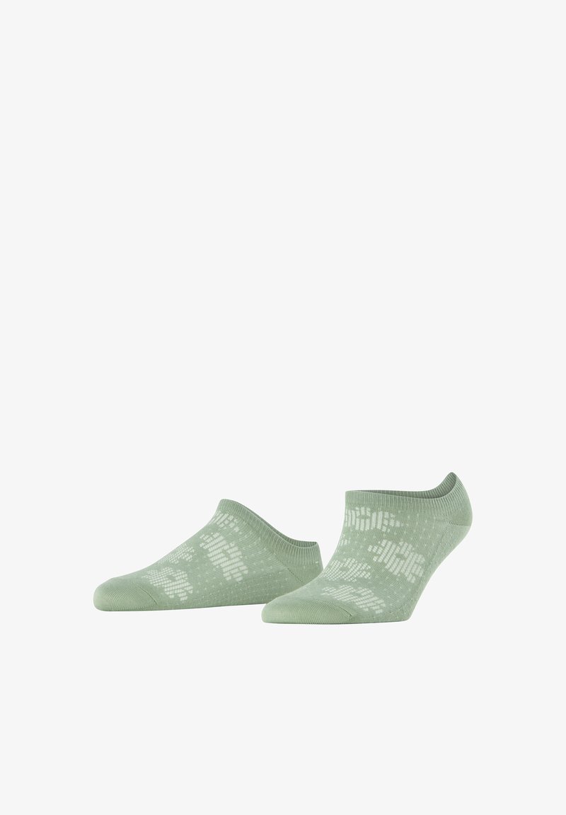 Paire de chaussettes basses vert clair avec des motifs abstraits blancs sur un fond blanc, vues de face et de côté.