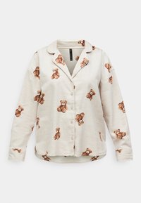 Kortermet skjorte med knapper i lys beige stoff, prydet med brune teddy-bjørn trykk, med klassisk krage og brystlomme.