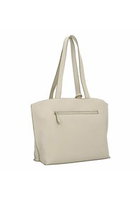 Sac fourre-tout beige avec deux longues anses, poche extérieure zippée, texture lisse et design minimaliste. Forme rectangulaire, sans motifs visibles.