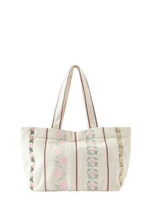 Sac fourre-tout en tissu beige avec des rayures florales verticales en rose, vert et marron, et deux longues anses avec bords cousus.