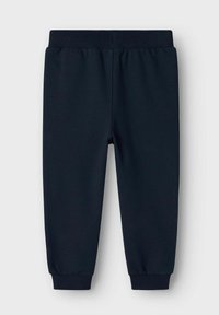 Pantaloni jogger blu navy realizzati in morbido cotone, con vita elastica, polsini a coste e una trama liscia senza motivi o decorazioni.