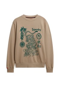 Felpa beige con illustrazione di una tigre verde scuro, bambù, design circolare, caratteri giapponesi e testo "Superdry" sul davanti.