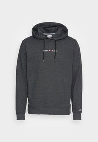 Hoodie gris foncé avec le logo "Tommy Jeans" sur le devant en blanc et rouge, doté de cordons noirs et de poignets et ourlet côtelés.