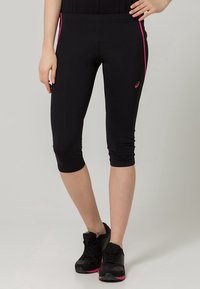 Black athletic capri leggings with pink side stripes, fitted design, and smooth texture. Features a logo on the left hip and elastic waistband.