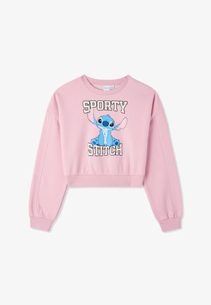 Różowa, skrócona bluza z długim rękawem. Posiada grafikę postaci niebieskiego Stitcza oraz wyrazisty napis "SPORTY STITCH" na froncie.