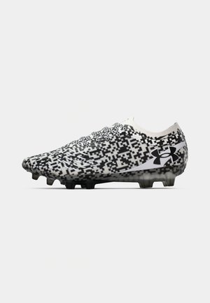 Black and white patterned soccer cleat with a low profile, textured upper, and rounded toe. Features black studs and a white logo on the side.