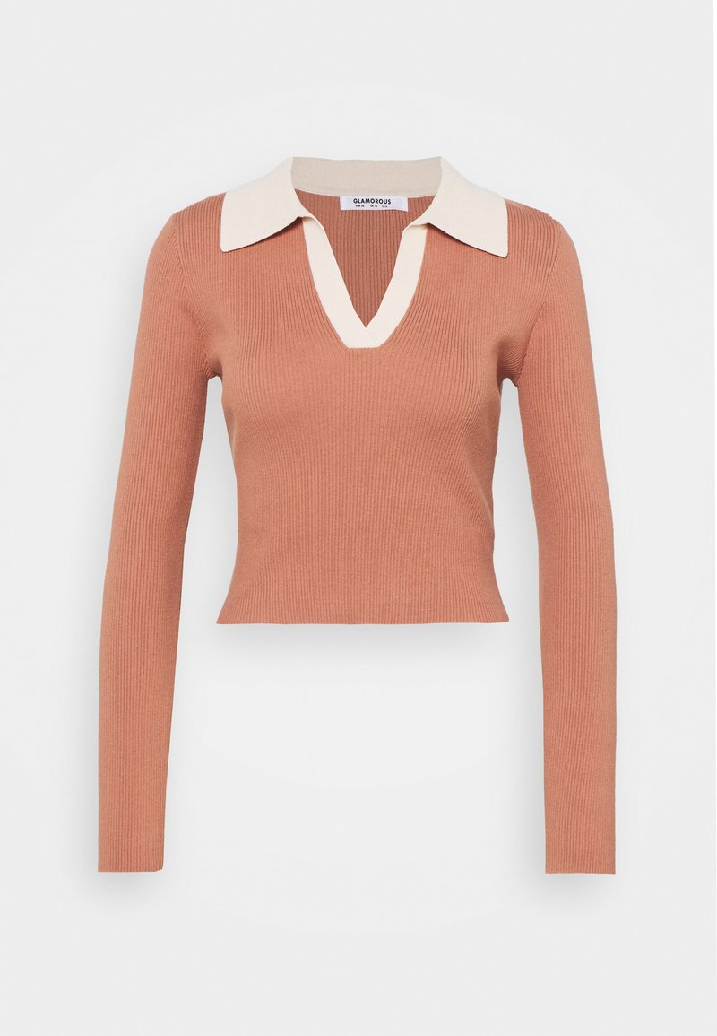 Top de manga longa canelado de cor ferrugem com decote em V e detalhes em cor creme na gola. Design cropped com silhueta ajustada.