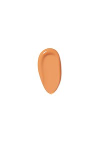 Campione di trucco liquido beige con una consistenza liscia, finitura leggermente lucida e forma ovale arrotondata su uno sfondo bianco.