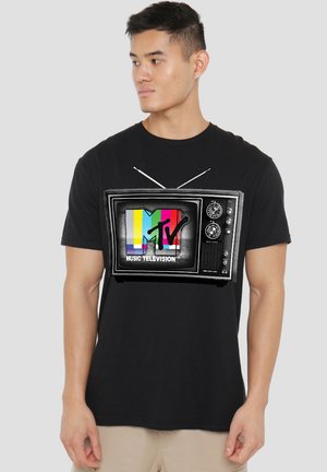 Black t-shirt featuring a vintage TV graphic with multicolored MTV logo and the text "MUSIC TELEVISION" in white, short sleeves, cotton fabric.
