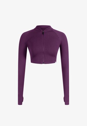 Veste courte violette avec un col haut, fermeture éclair frontale intégrale et manches longues. Fabriquée en tissu extensible côtelé pour un look ajusté.