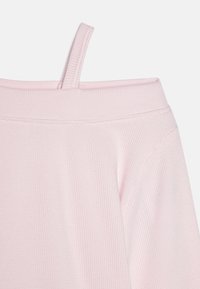 Pink ribbed top with off-the-shoulder design, featuring thin straps and a smooth texture, highlighted by subtle stitching details.