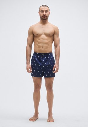 Mornarsko modre kopalne kratke hlače iz lahkega materiala z vzorcem ponavljajočih se majhnih konjskih logotipov, elastičnim pasom in stranskimi žepi.