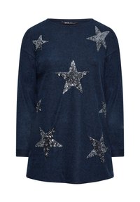 Marinblå stickad tröja med silverfärgade paljetter i form av stjärnor. Rund hals och långa ärmar med textilstruktur, avslappnad passform för komfort.