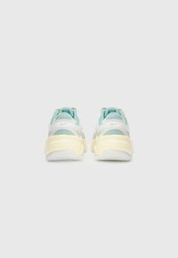 Sneakers with a pastel color scheme featuring light blue and cream materials, mesh accents, and a textured yellow sole.