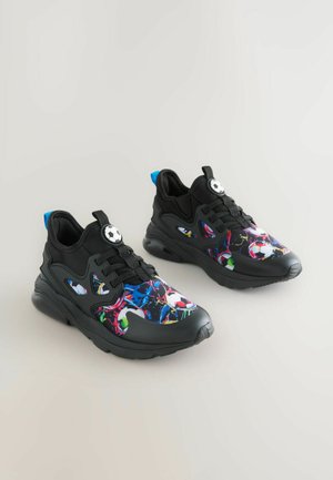 Black sneakers with a multicolored abstract pattern featuring soccer balls. Includes a lace-up design and blue accents on the heel.