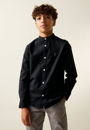 Next, Pluus - black