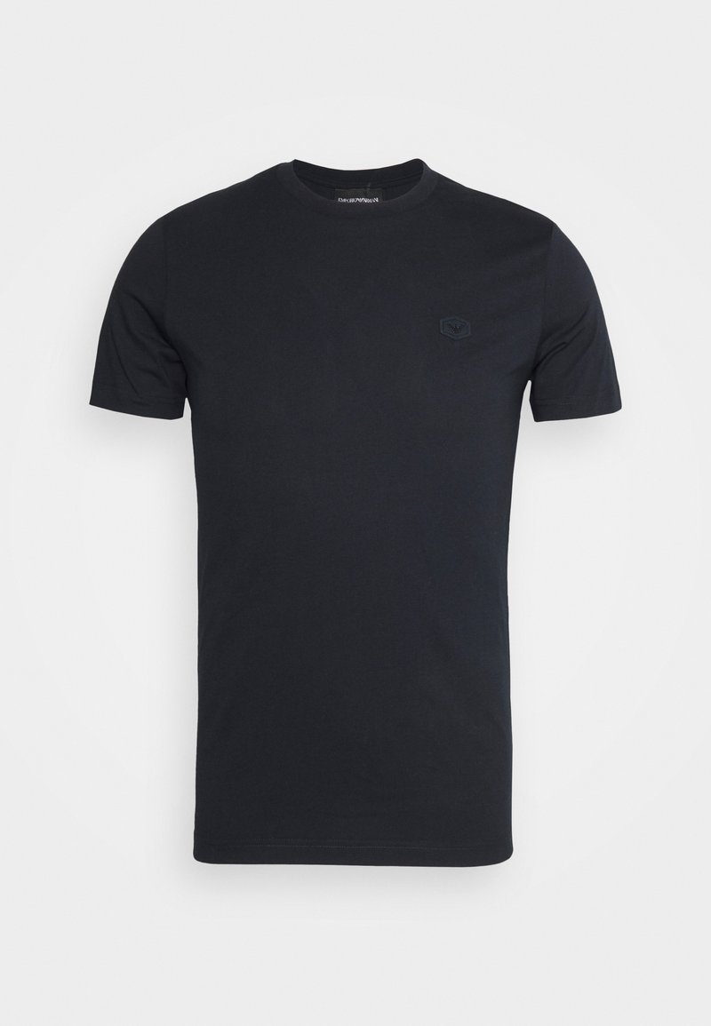 Black short-sleeve crew neck t-shirt with a small black embroidered logo on the left chest against a white background.