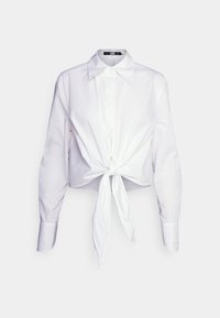 Chemise blanche à manches longues avec boutons, col pointu et nœud noué à l'avant à la taille.
