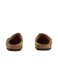 Sandales brunes avec une semelle en liège texturée, bande réglable au niveau du talon et conception à dos ouvert. Intérieur lisse et légèrement rembourré.