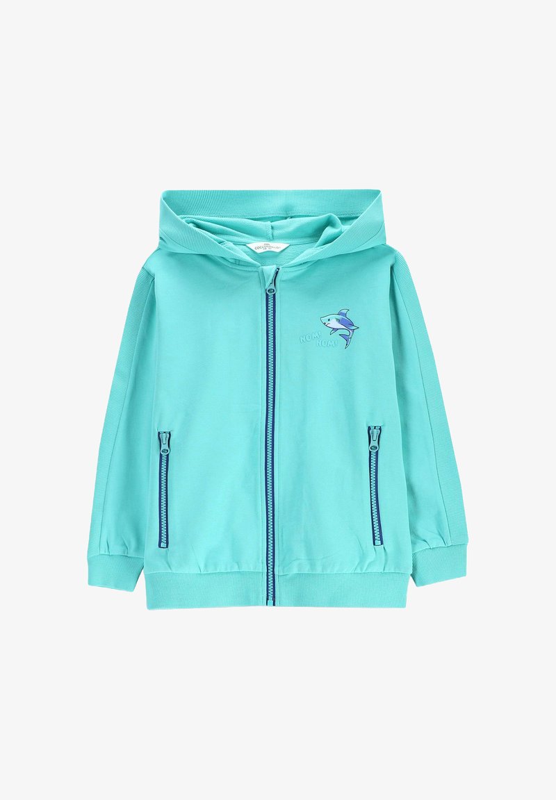 Jasnoniebieska bluza z suwakiem wykonana z miękkiego materiału, z grafiką rekina na klatce piersiowej i dwoma bocznymi kieszeniami zapinanymi na zamek.