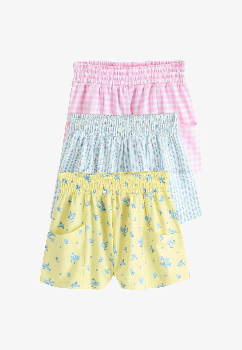 Tre paia di pantaloncini con vita elastica impilati: vichy rosa, bianchi a strisce blu con motivi floreali, e gialli con stampa floreale blu.