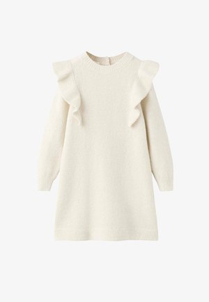 Kremasta pletena haljina s dugim rukavima, ukrašena volanima duž ramena, okruglim izrezom i rebrastim rubom. Meki tekstura.