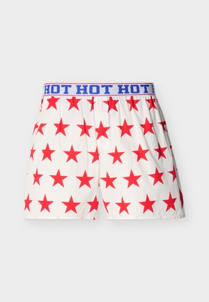 Red star-patterned shorts with a white background and a blue waistband featuring the repeated text "HOT HOT HOT." Lightweight material.