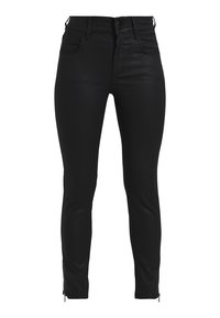 Jean skinny noir en tissu extensible, avec une taille haute, des poches avant et arri ère, et des accents zippés au niveau des chevilles.