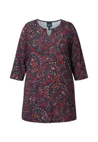 Langsleeve tuniek met een V-hals, voorzien van een meerkleurig paisleypatroon op een zwarte achtergrond. Gemaakt van een zachte, lichte stof.