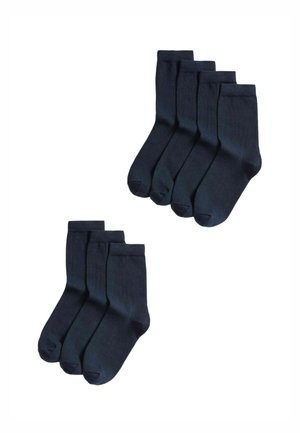 Paquet de six chaussettes en coton bleu marine, présentant une texture lisse et des bords côtelés. Chaque chaussette a un design classique et une couleur unie.