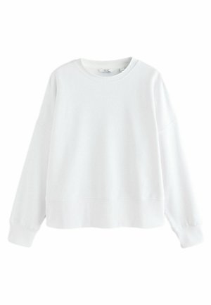 Hanorac alb, realizat dintr-un material moale, având guler rotund, umeri lăsați și manșete din tricot. Design simplu, minimalist.