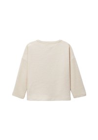 Pull beige clair avec motif en maille texturée, manches 3/4 et encolure ronde. Coupe décontractée et dos uni.