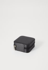 Black square zippered case with a smooth exterior, featuring a metallic zipper pull, ideal for storing small items or accessories.