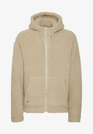 Hanorac din fleece bej, cu fermoar în față, țesătură texturată, două buzunare frontale și glugă cu șnur. Prezintă un mic logo pe partea stângă jos.