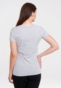 Gray short-sleeve t-shirt made from soft material, featuring a crew neck and a fitted design. No visible patterns or accents.