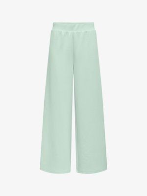 Pantalon large vert menthe clair avec un tissu doux et extensible, et une taille élastique, présentant une texture lisse sans motifs visibles.