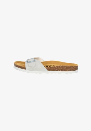 Slide sandal with a textured metallic silver strap and adjustable silver buckle, cork footbed, and white rubber sole.
