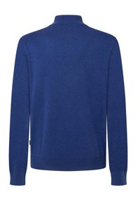 Pullover blu con colletto alto, maniche lunghe e polsini e orlo a coste. Realizzato in un morbido materiale knit leggero.